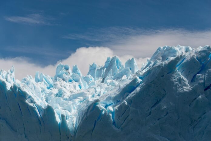 white ice formation under white clouds