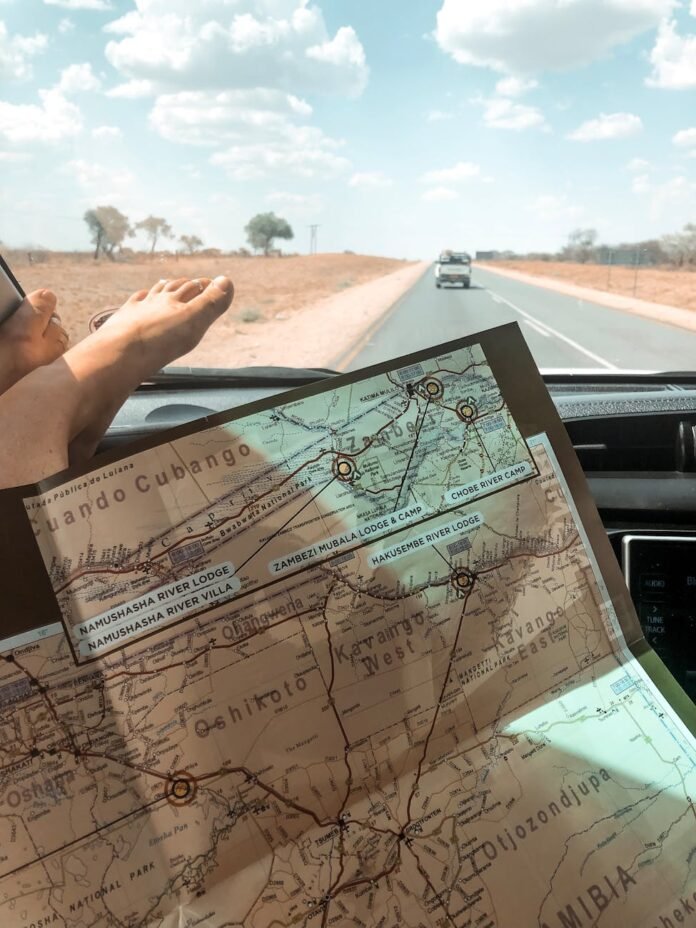 person holding direction map