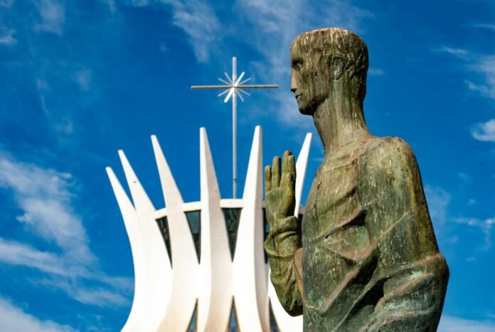 monument in front of cathedral in brazil