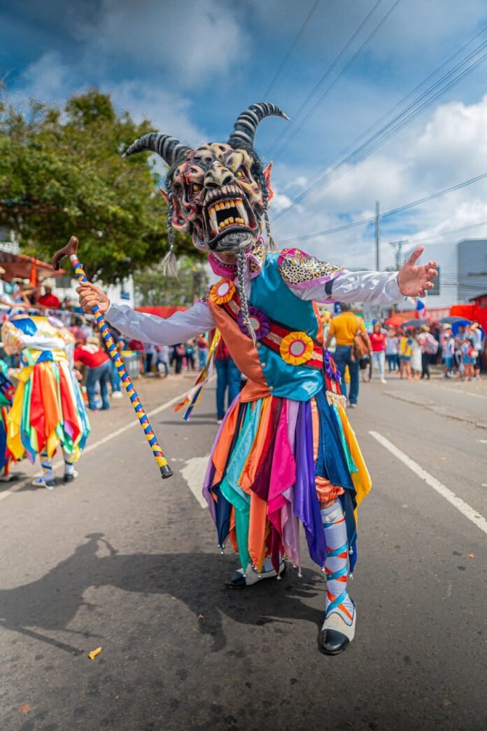 person in costume in event on street