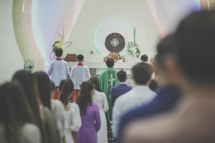 back view shot of people attending a mass