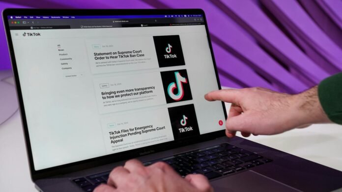 person browsing tiktok news on laptop screen