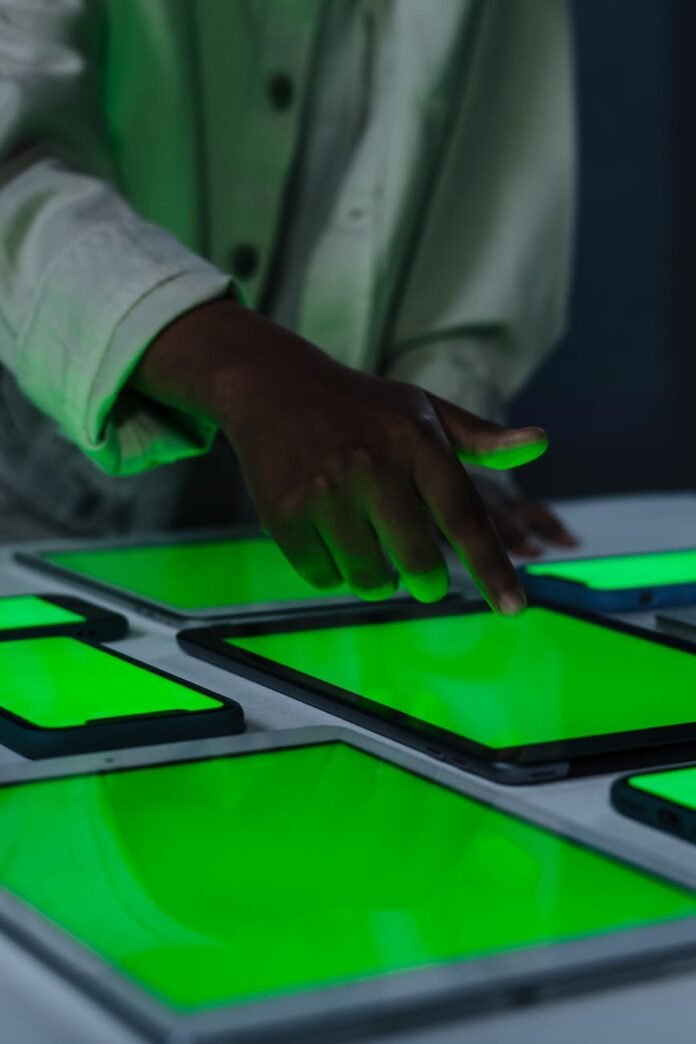 close up of touching gadget with green screen