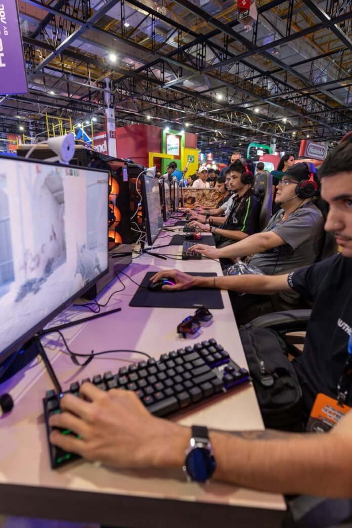 people playing computer games at a convention