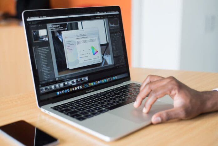 person operating macbook pro