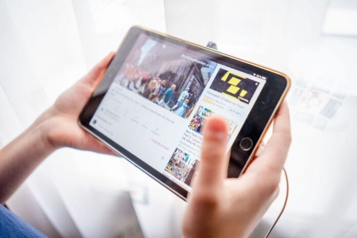 a person holding a tablet