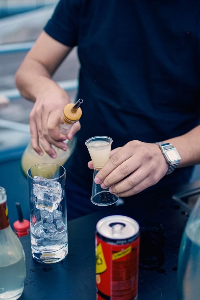 man preparing a drink at a party