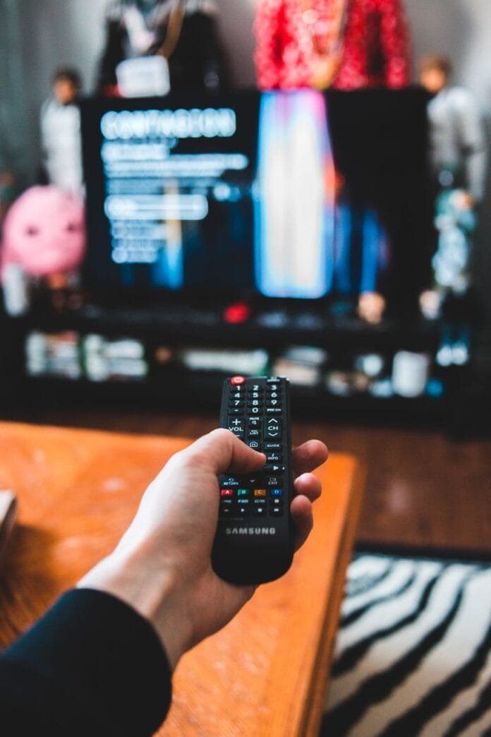 pexels photo 4048092 photo of person holding remote control