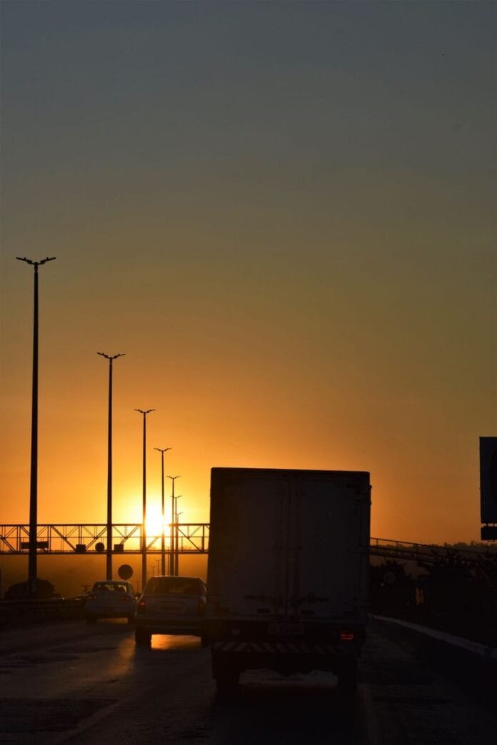 cars in a highway during sunset